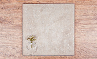 Delicate bouquet of flowers and a wooden abstract background. Gypsophila.