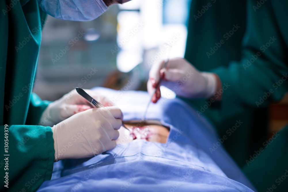 Poster Surgeons performing operation in operation theater