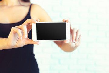 Woman with modern mobile phone in hands