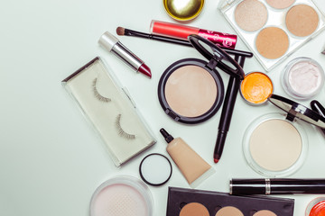 Brush and cosmetic isolated on a white background. Top view.