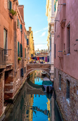 Fototapeta na wymiar Venice (Italy) - The city on the sea. Here a suggestive canal with bridge