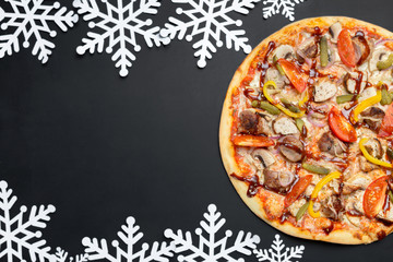 Pizza with snowflakes decoration. Winter pizza