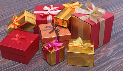 Gift boxes with bow on wood background