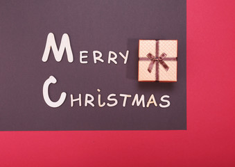 Merry christmas text and decorations on a red background
