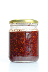 Glass jar with  jam isolated on the white background