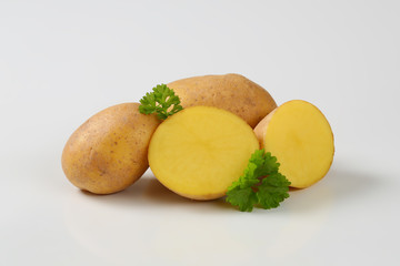 whole and halved potatoes
