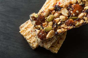 different granola bars on a slate plate