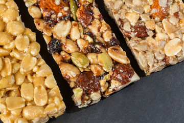 different granola bars on a slate plate