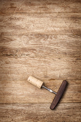 Fototapeta na wymiar corkscrew on the brown table