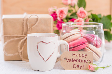 Morning coffee with flowers and macaroons. Mather's day Valentine' concept.