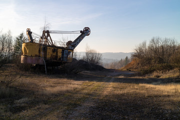 Fototapeta na wymiar Abandoned Soviet Excavator