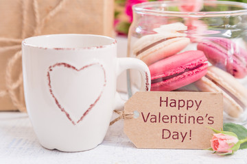 Morning coffee with flowers and macaroons. Mather's day Valentine' concept.