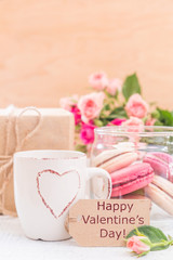 Morning coffee with flowers and macaroons. Mather's day Valentine' concept.