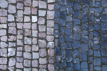The texture of the old cobblestone and unusual stones. Dark and Light