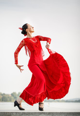 Flamenco dancer Spain womans in a long red dress