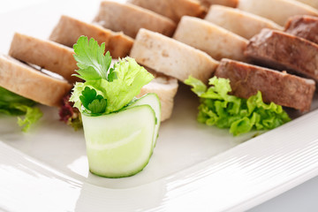 meatloaf sliced on a white background close uo