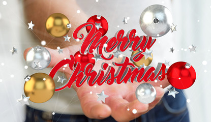 Businessman holding floating christmas message in his hand 3D re