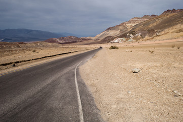 Desert landscape and narrow road of the scenic Artist Drive in the Death Valley National Park, CA