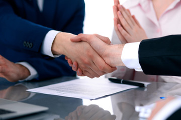 Business people shaking hands finishing up a meeting