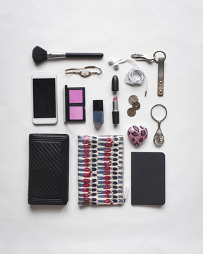 High angle view of accessories arranged on white background