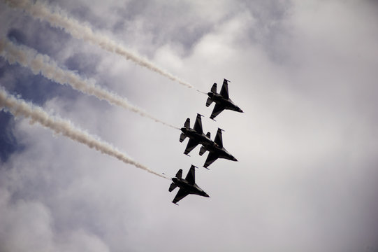 Low angle view of military airplanes flying in sky during airshow