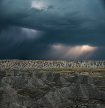 Scenic view of Badlands National Park against cloudscape