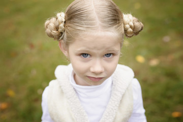 Portrait of girl standing in backyard