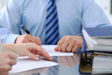 Bookkeepers or financial inspector making report, calculating or checking balance. Audit concept.