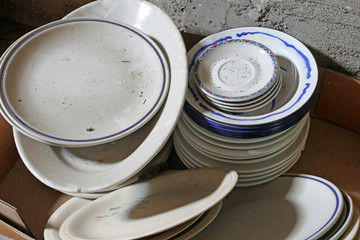 many ceramic plates and bowls broken