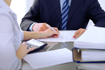 Bookkeepers or financial inspector making report, calculating or checking balance. Audit concept.