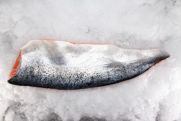 Fresh raw salmon fillet on ice
