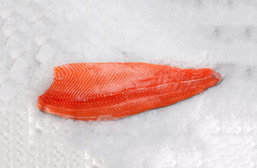 Fresh raw salmon fillet on ice
