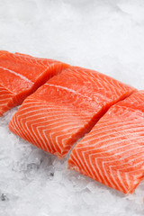 Fresh raw salmon fillet on ice