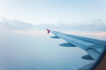 View from plane window, cloud sky