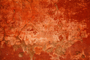 Design space. Abstract bright red background. Wall concrete damaged by time. Flat background with scratches and cracks