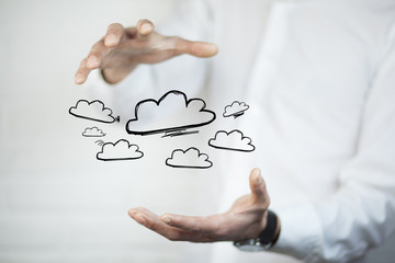 Man working with touch screen- clouds