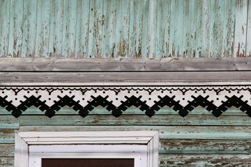 artsy decor trim and classic old wooden house. triangular patterns  wood texture turquoise color.