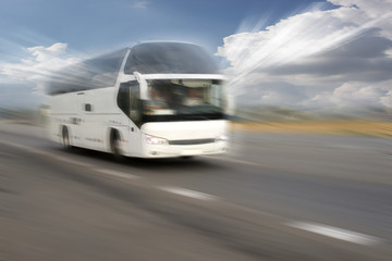 Motion blurred image of driving bus