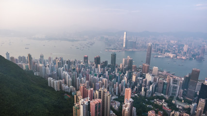 Aerial view of a stunning sunset over Hong Kong island Central business district and the Victoria Harbor.