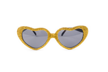 A pair of golden glasses with black lenses isolated on white background. Extravagant party goggles. Carnival accessory. Closeup. Front view. - obrazy, fototapety, plakaty