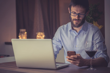 Man working on a laptop at night