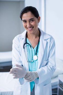 Beautiful Doctor Wearing Gloves In Hospital