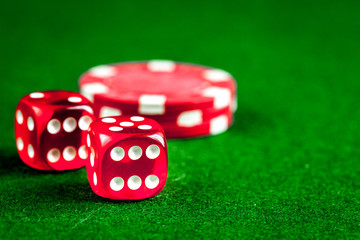 stack of chips play poker on green background close up