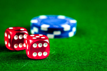 stack of chips play poker on green background close up