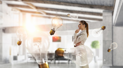 Businesswoman in her office . Mixed media