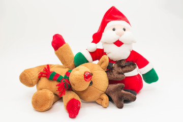 Santa doll and reindeer doll on white background.