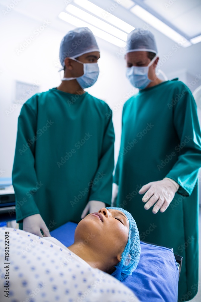 Poster surgeons operating in operation theater