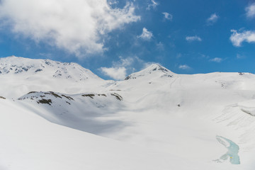 High mountains under snow with clear blue sky