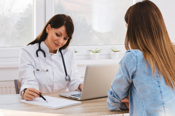 Patient Having Consultation With Doctor In Office
