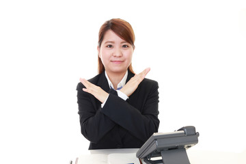 禁止の意思表示をするビジネスウーマン